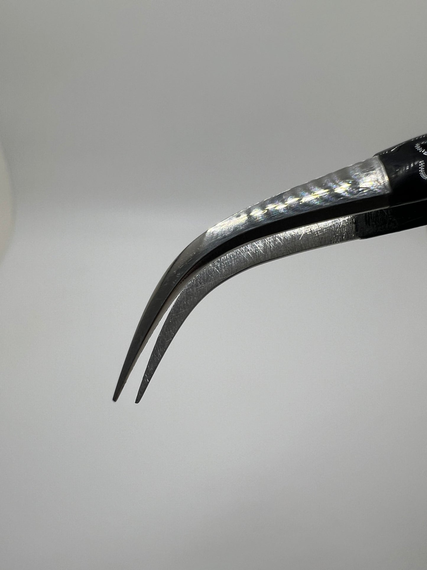Black curved isolation tweezer