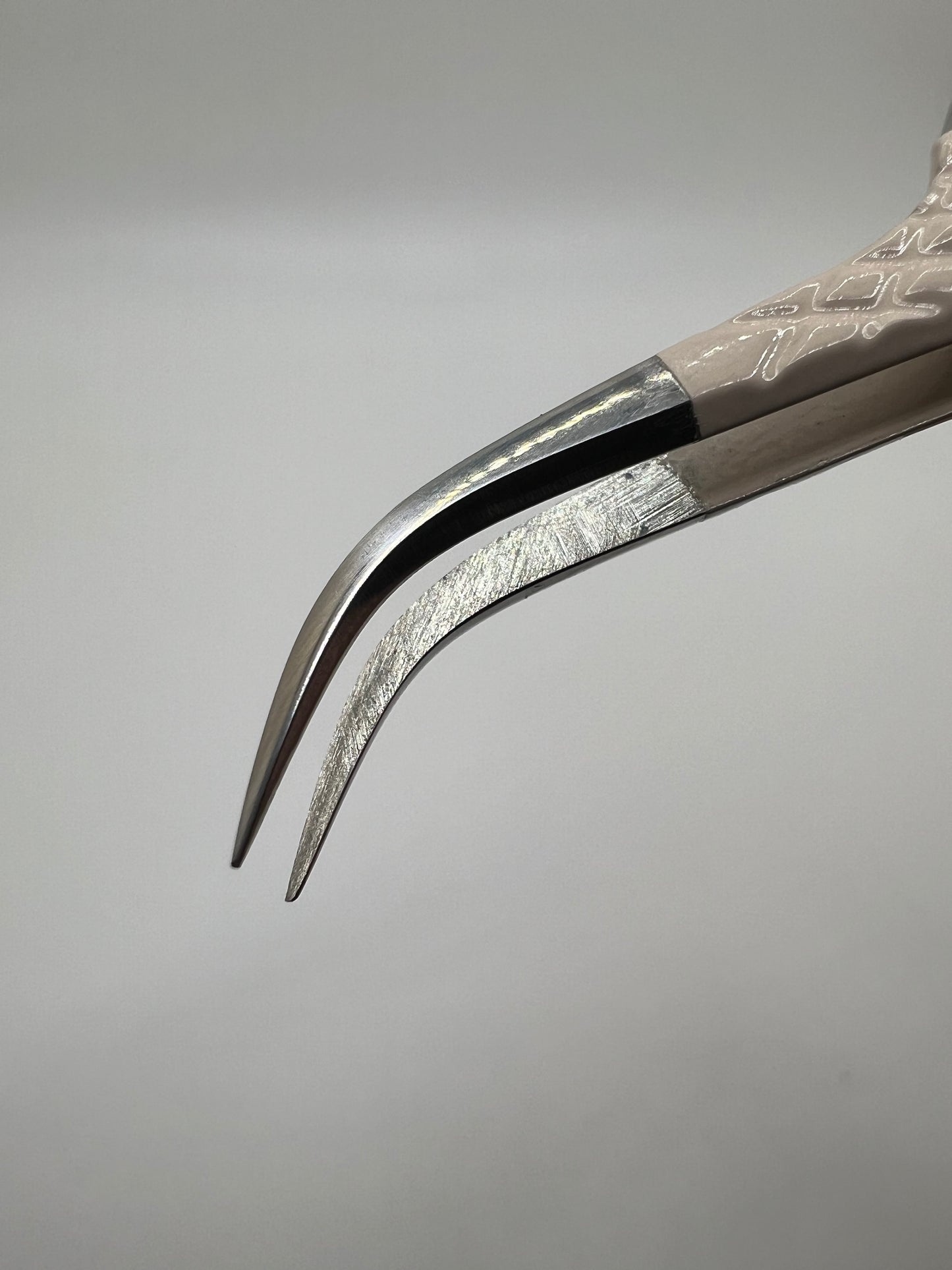 Nude curved isolation tweezer