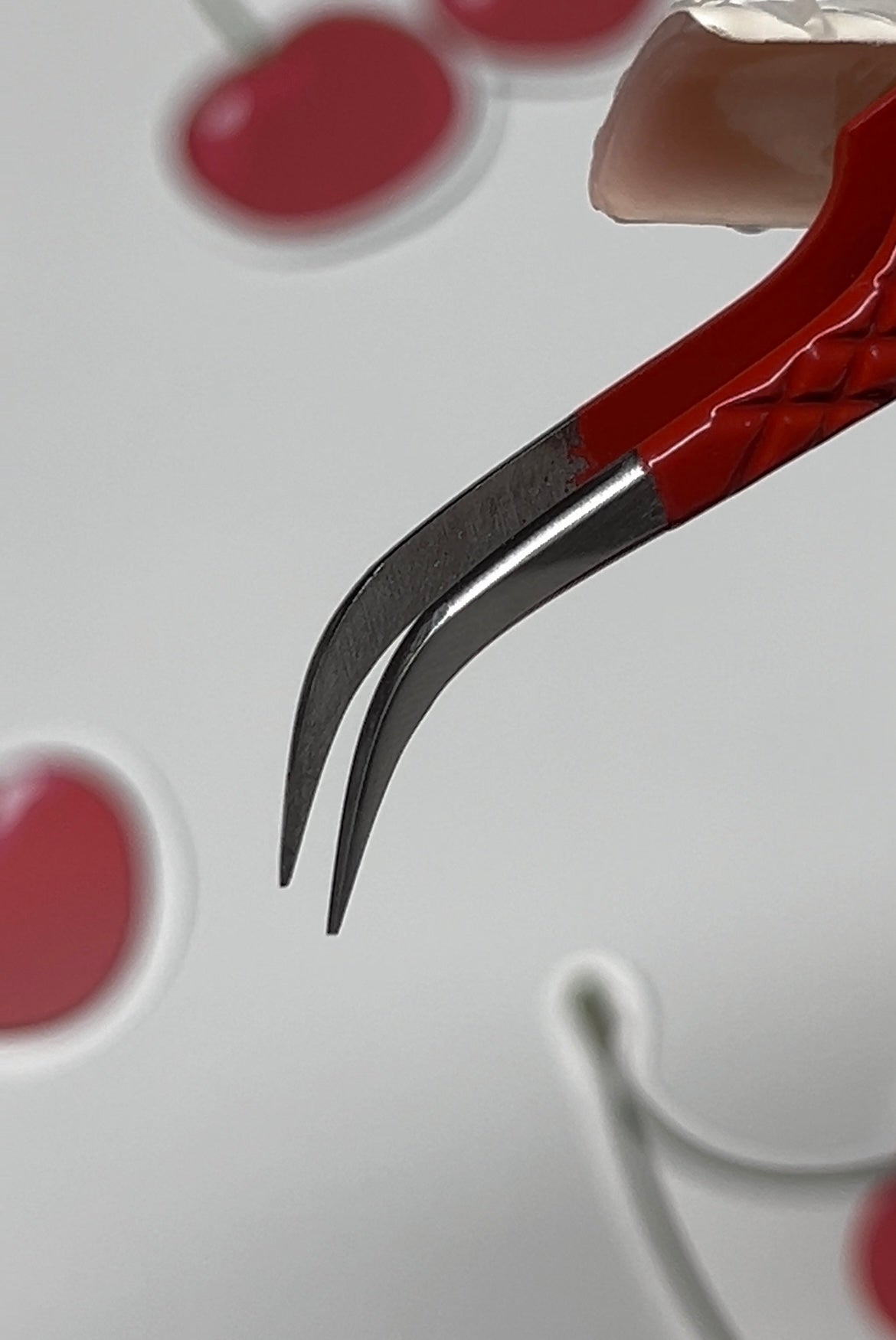 Red curved isolation tweezer