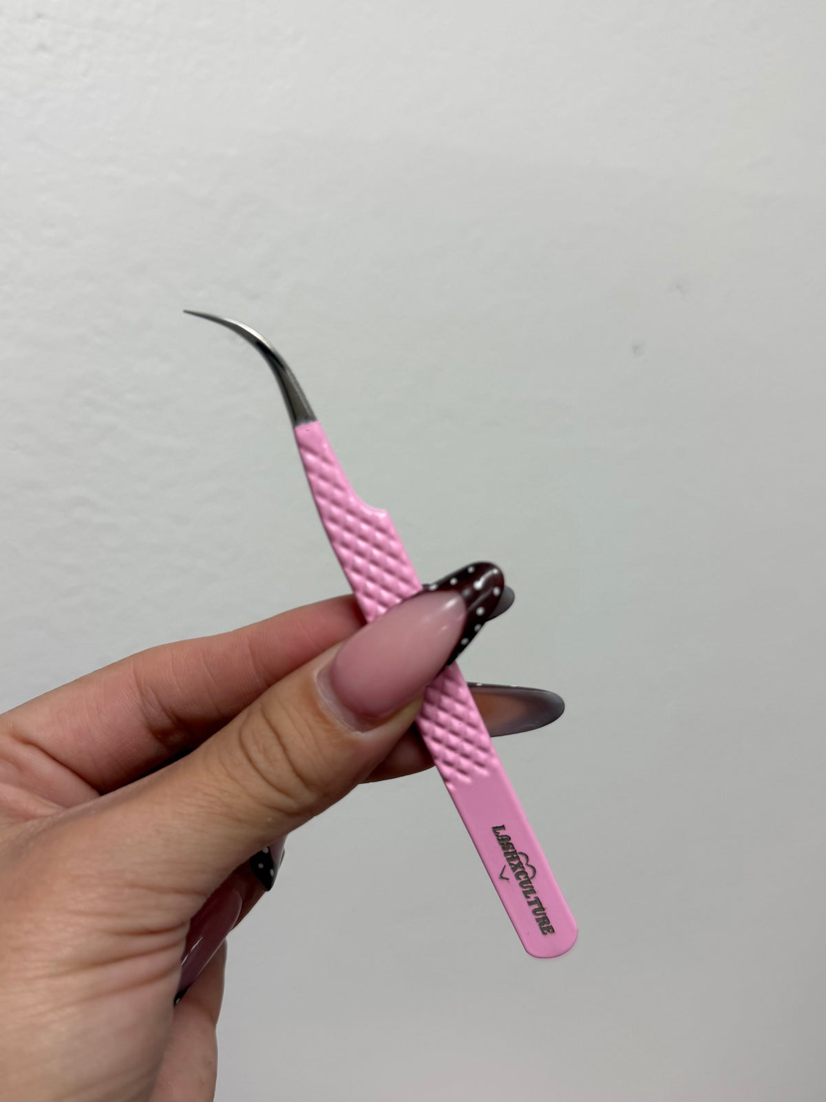 Pink curved isolation tweezer