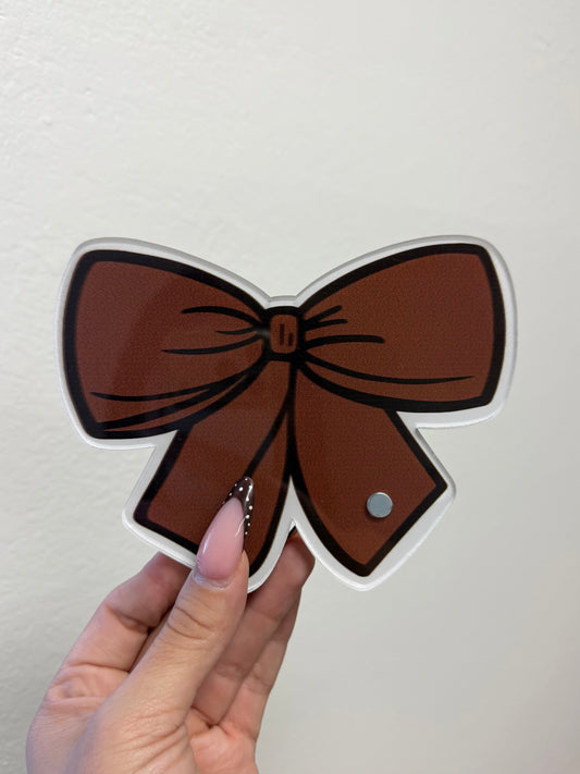 Brown bow lash tile