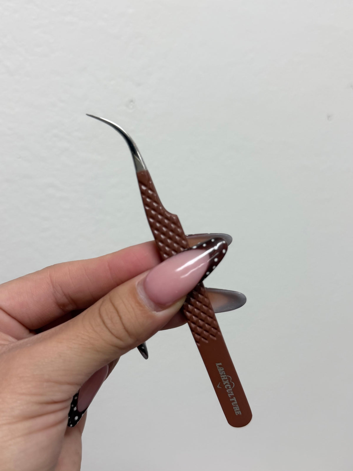 Brown curved isolation tweezer