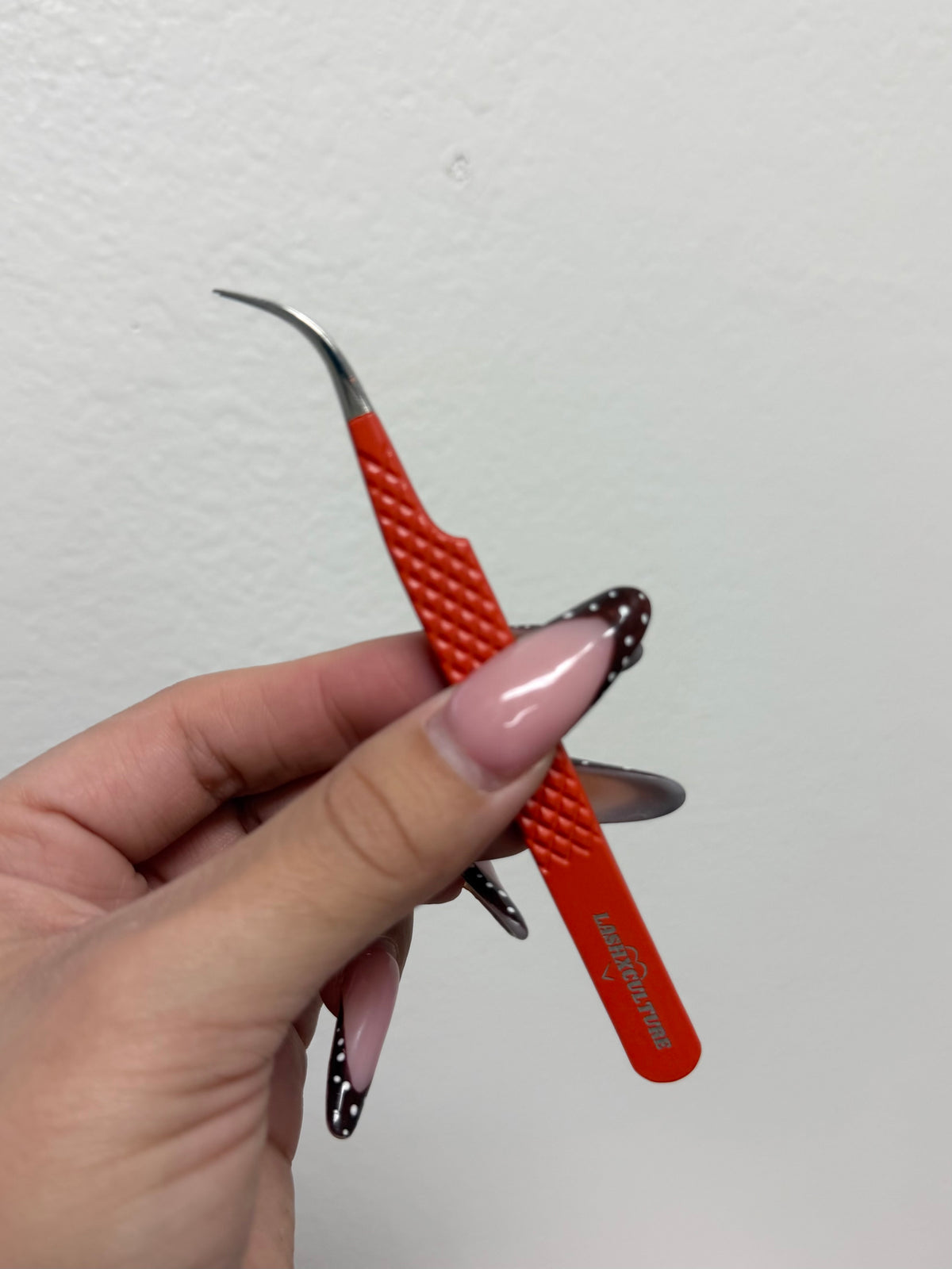 Orange curved isolation tweezer
